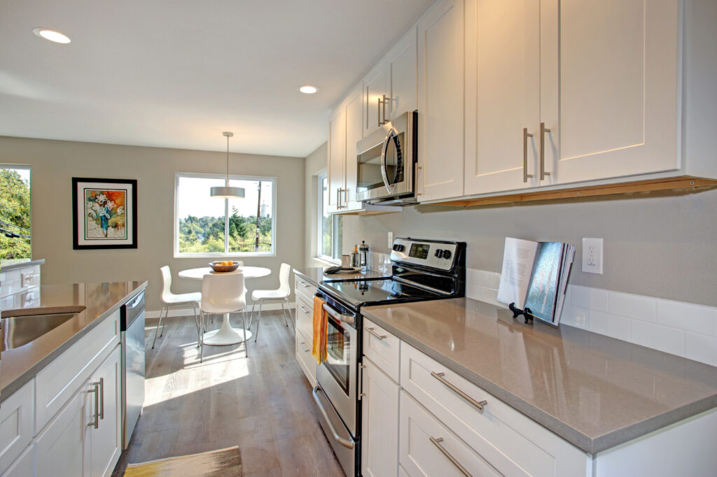 Grey countertops with white cabinets